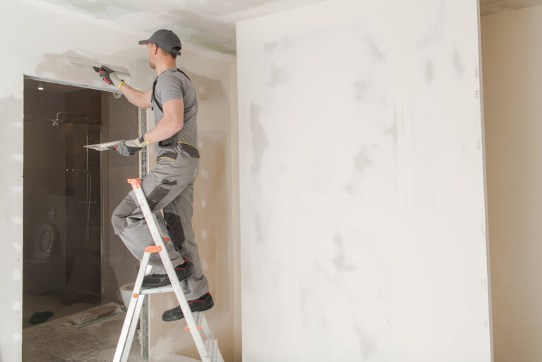 Boston Painting providing expert plastering services for smooth walls.